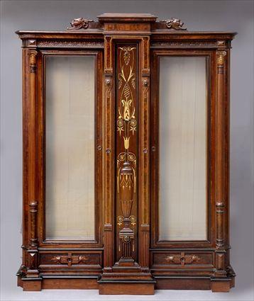 Appraisal: WALNUT RENAISSANCE REVIVAL THREE-DOOR BOOKCASE The center door having a