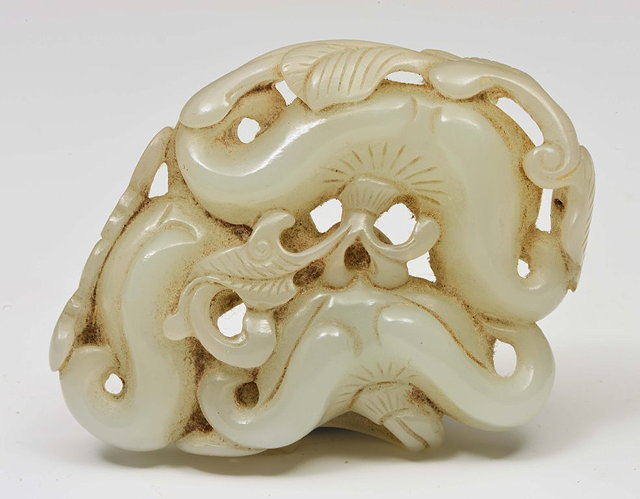 Appraisal: A CHINESE MUTTON FAT JADE PENDANT pierced and carved as