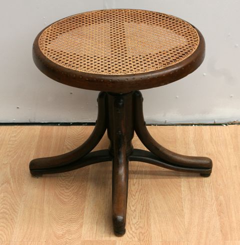 Appraisal: A th century bentwood and caned swivel stool cm diameter