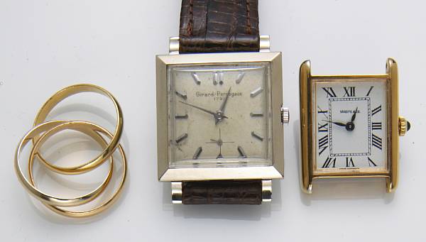 Appraisal: An k gold rolling ring Cartier together with two k