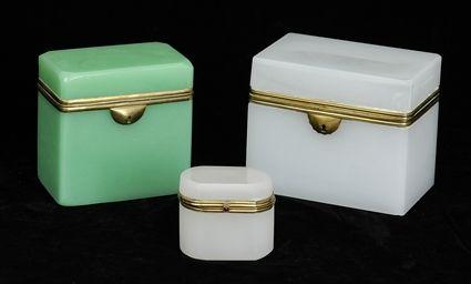 Appraisal: GROUP OF THREE FRENCH BRASS-MOUNTED OPALINE BOXES Comprising of rectangular-form