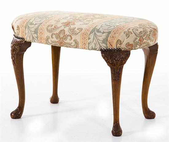 Appraisal: Chippendale style walnut footstool late th century oval overupholstered padded