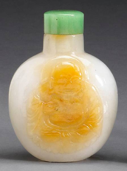 Appraisal: A carved white jadeite snuff bottle Late Qing Dynasty Well-hollowed