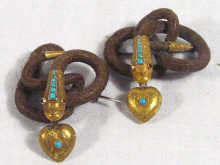 Appraisal: A pair of antique gold mounted woven hair serpent brooches