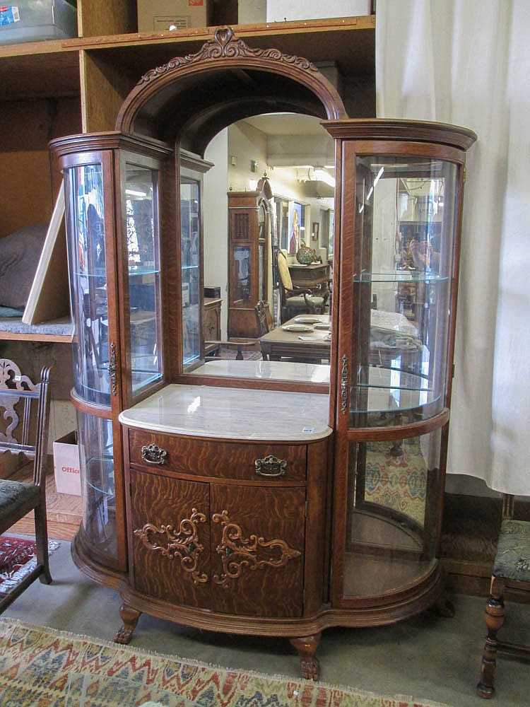 Appraisal: LARGE OAK AND CURVED GLASS CHINA SIDEBOARD American last quarter