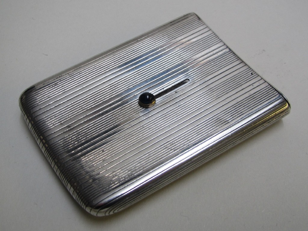 Appraisal: A Cartier silver engine turned cigarette case with push out