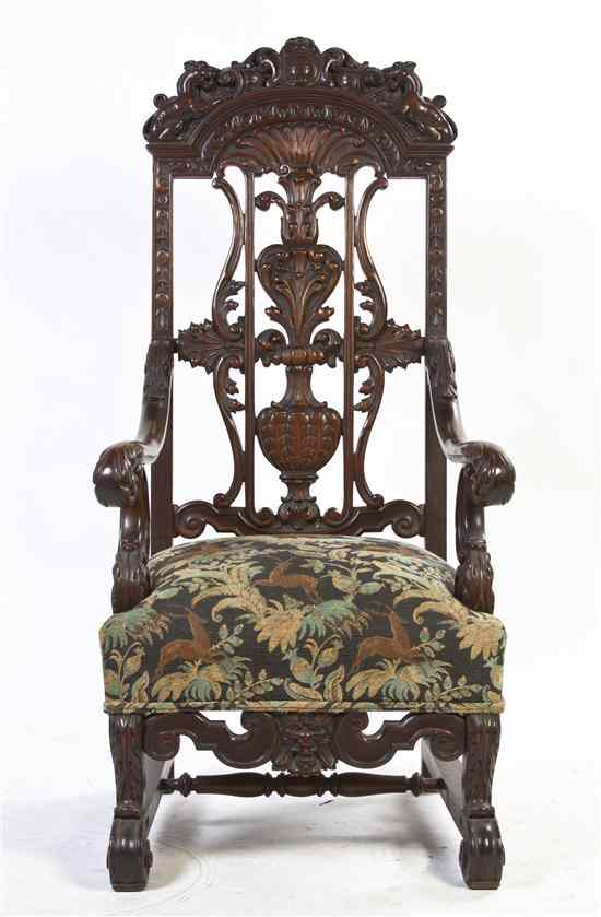 Appraisal: A Continental Carved Armchair having a scrollwork carved crest flanked