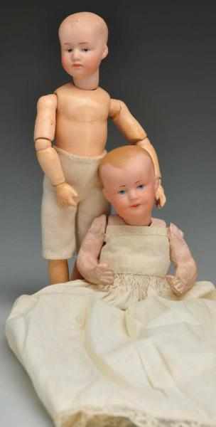 Appraisal: Lot of German Bisque Character Dolls Description Gebr Heubach pouty