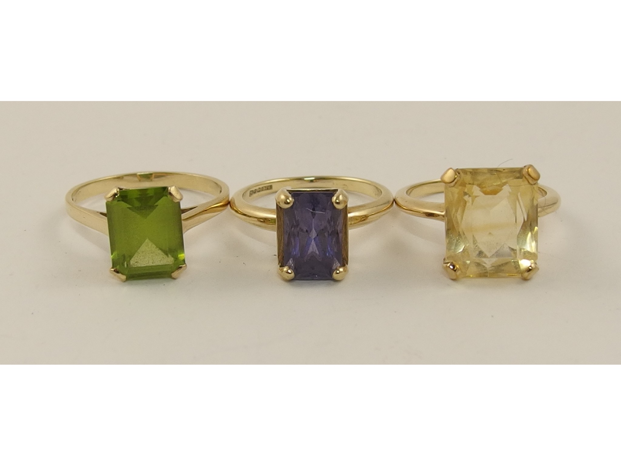 Appraisal: Three ct rings set with peridot citrine and iolite