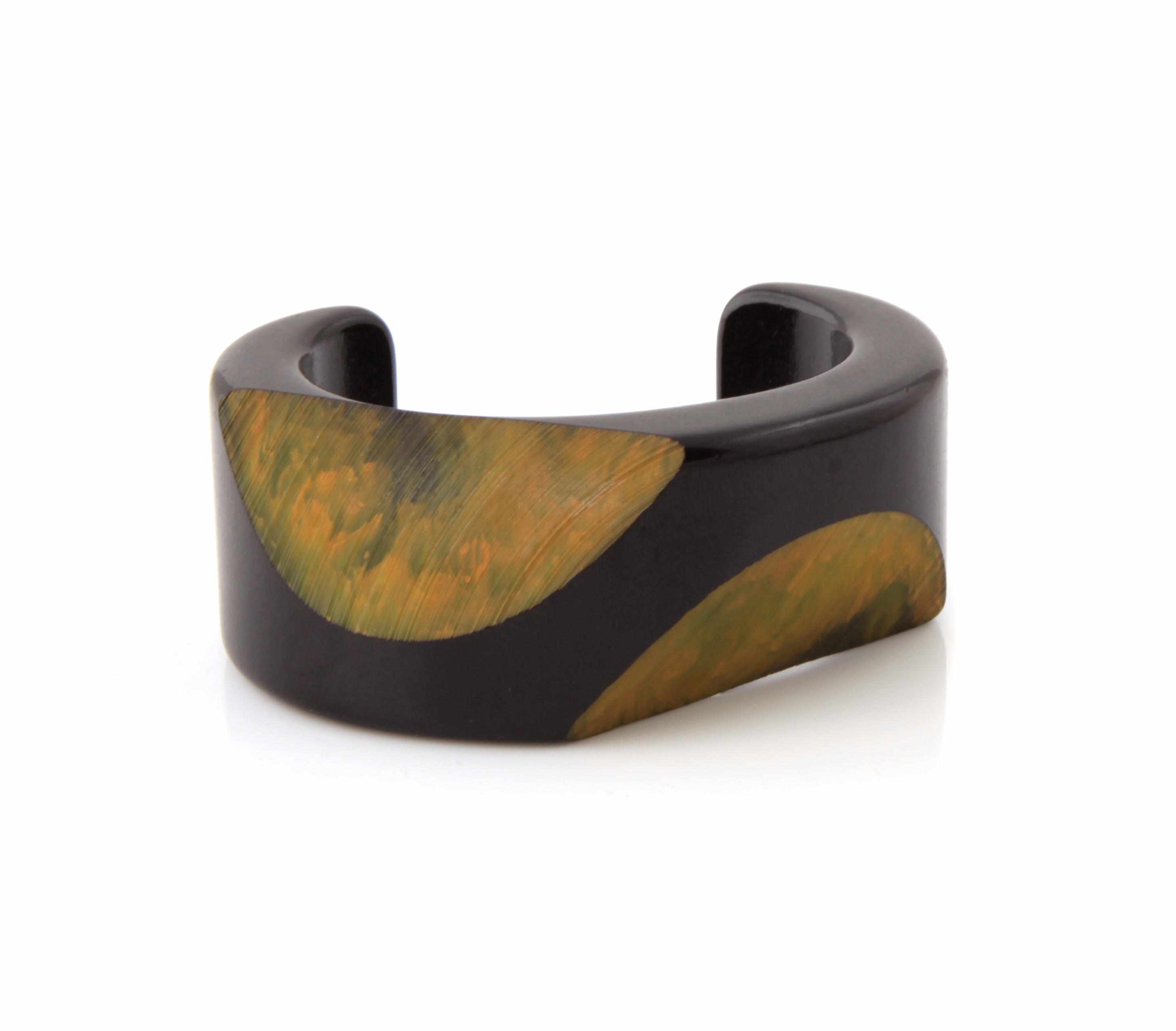 Appraisal: A two-tone Bakelite ''double slice'' bangle bracelet diameter in