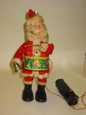 Appraisal: A Japanese novelty Father Christmas c tin plate with celluloid