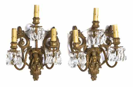 Appraisal: A Pair of Continental Gilt Metal Three-Light Sconces each having