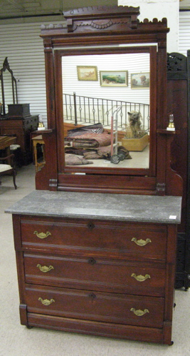 Appraisal: VICTORIAN WALNUT DRESSER Eastlake design c with attached rectangular tilt