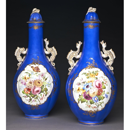 Appraisal: A pair of Staffordshire dragon handled bone china bottle shaped