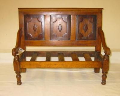 Appraisal: A doll's settle in beech oak and crossbanded mahogany with