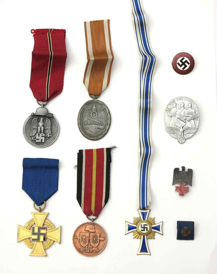 Appraisal: COLLECTION OF WWII GERMAN BADGES MEDALS To include year medal