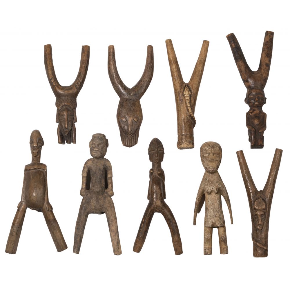 Appraisal: AFRICAN CARVED WOOD SLINGSHOT ASSORTMENT slingshots having a forked sling