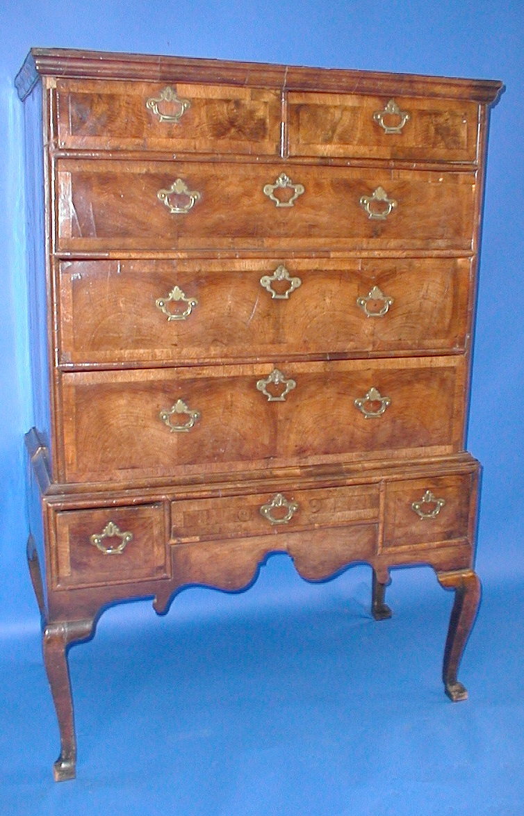 Appraisal: An early Georgian walnut chest on stand with two short