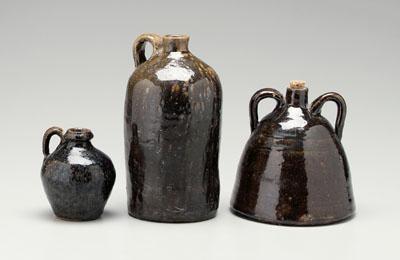 Appraisal: Three alkaline glaze stoneware jugs one cylindrical with rounded shoulder