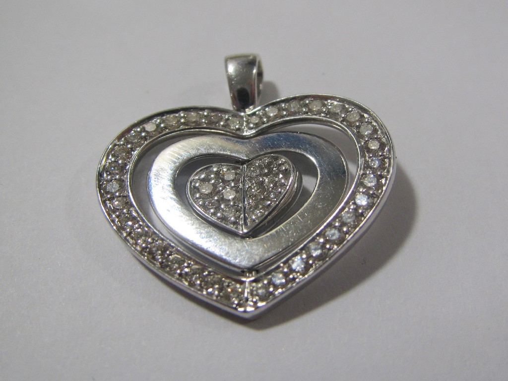 Appraisal: Eighteen carat white gold diamond set heart shaped pendant with