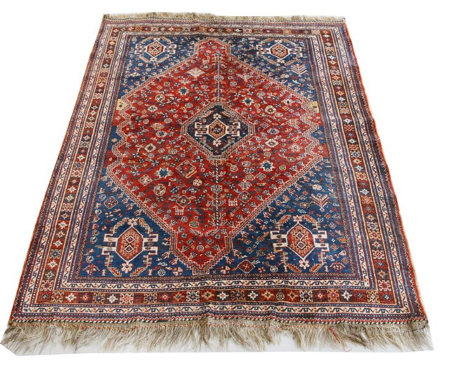 Appraisal: A QASHQ'AI RUST GROUND RUG OR SMALL CARPET with central