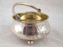 Appraisal: A Russian silver swing handled bowl on three ball feet