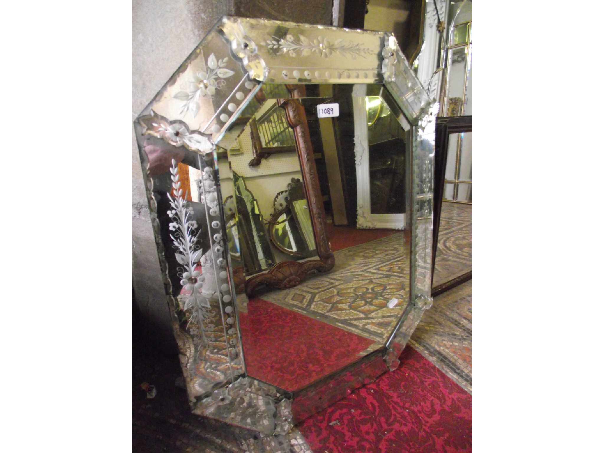 Appraisal: A Venetian wall mirror of elongated octagonal form with central