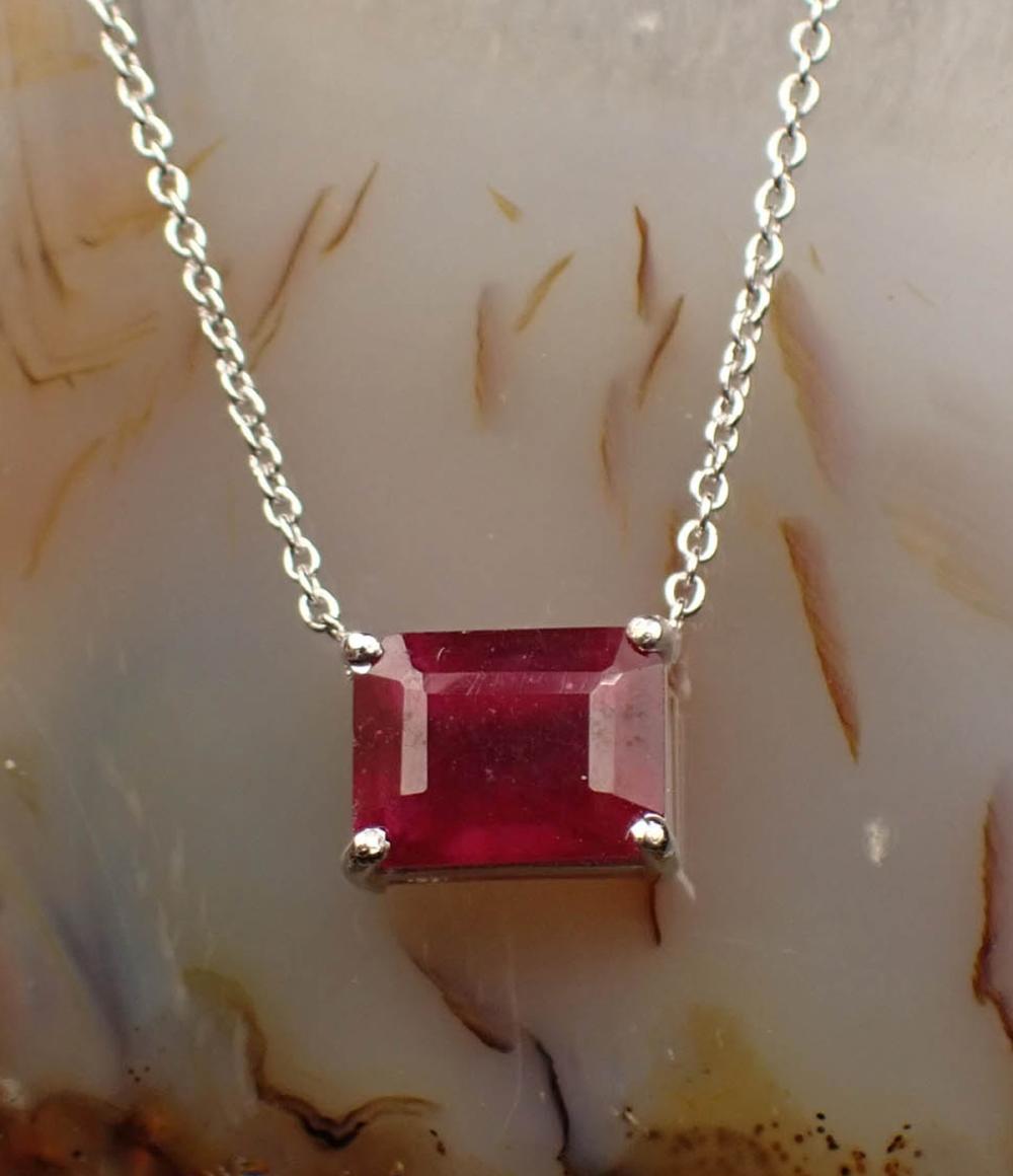 Appraisal: RUBY AND FOURTEEN KARAT WHITE GOLD NECKLACE with a length