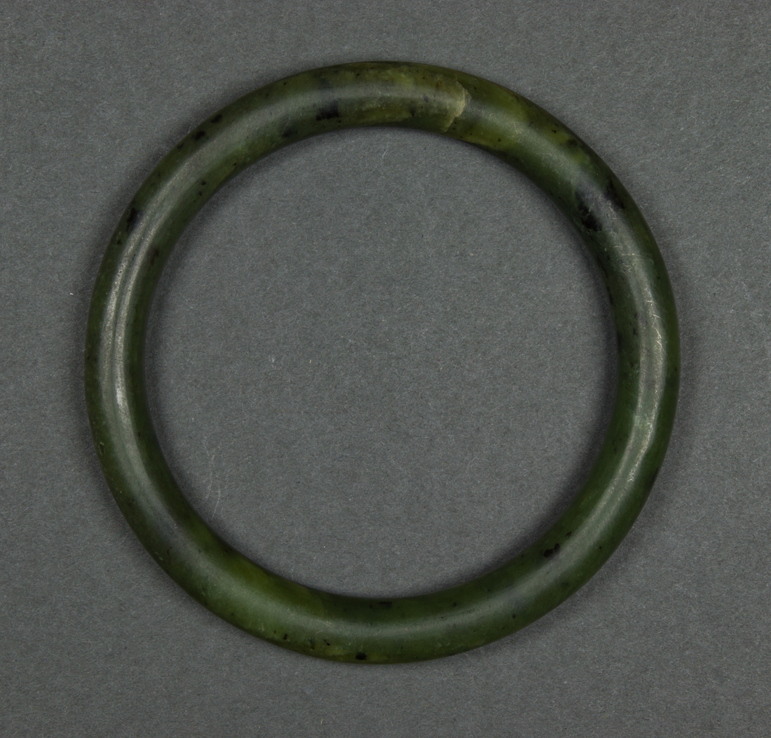 Appraisal: CHINESE SPINACH JADE BANGLE Chinese spinach jade bangle dia