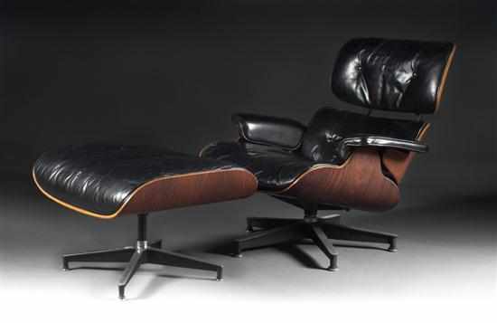 Appraisal: Charles Eames rosewood veneer and metal black leather upholstered lounge