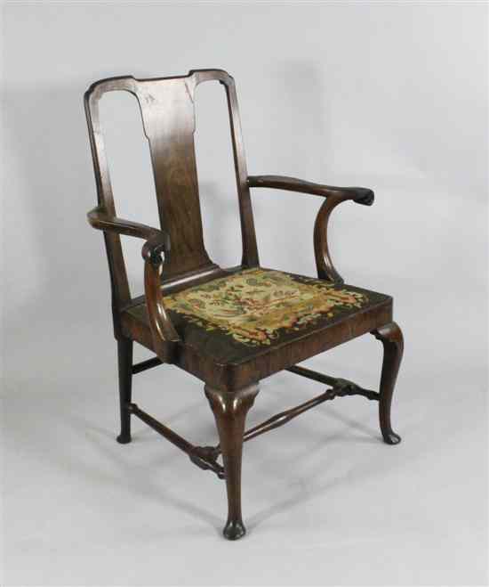 Appraisal: A George II walnut mahogany open armchair with drop in