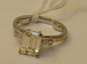 Appraisal: A SOLITAIRE DIAMOND RING the emerald cut stone of approximately