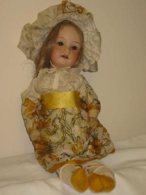 Appraisal: An Armand Marseille bisque head girl doll with brown glass