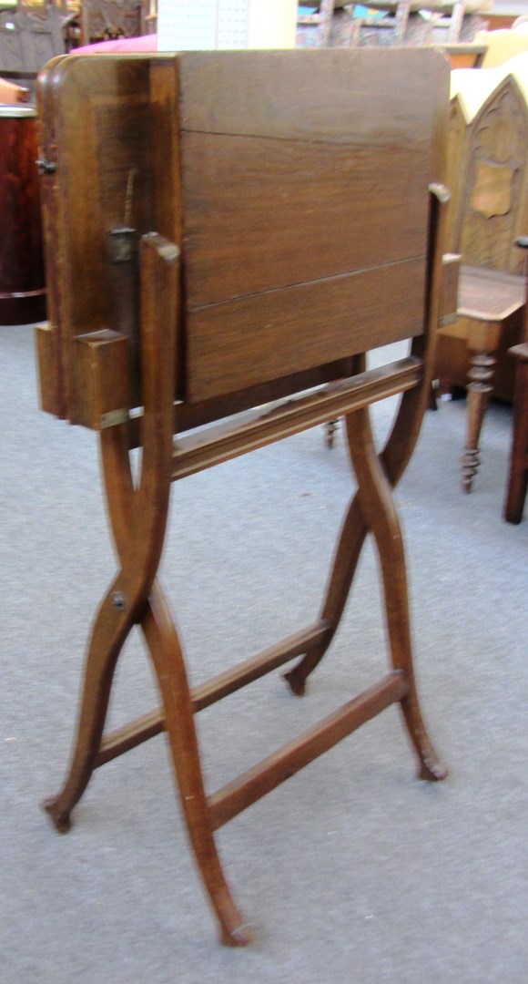 Appraisal: A patent oak folding games table with Maple Co label