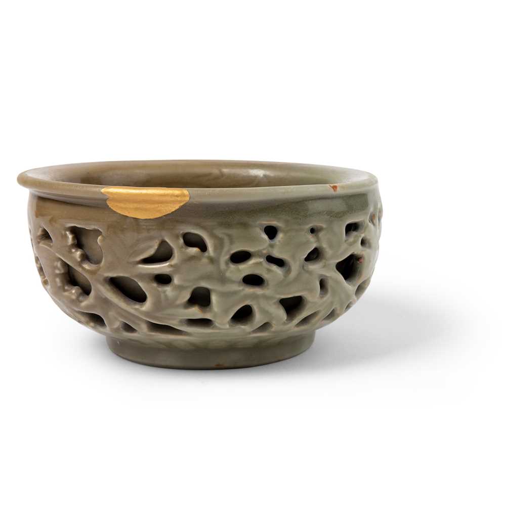 Appraisal: LONGQUAN CELADON RETICULATED WARMING BOWL MING DYNASTY the heavily-potted bowl