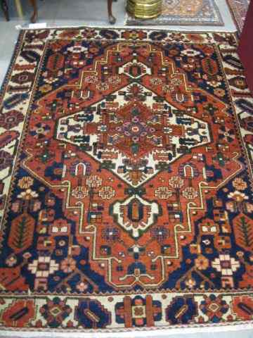 Appraisal: Bakhteiari Persian Handmade Rug large central medallion geometrics primarily reds