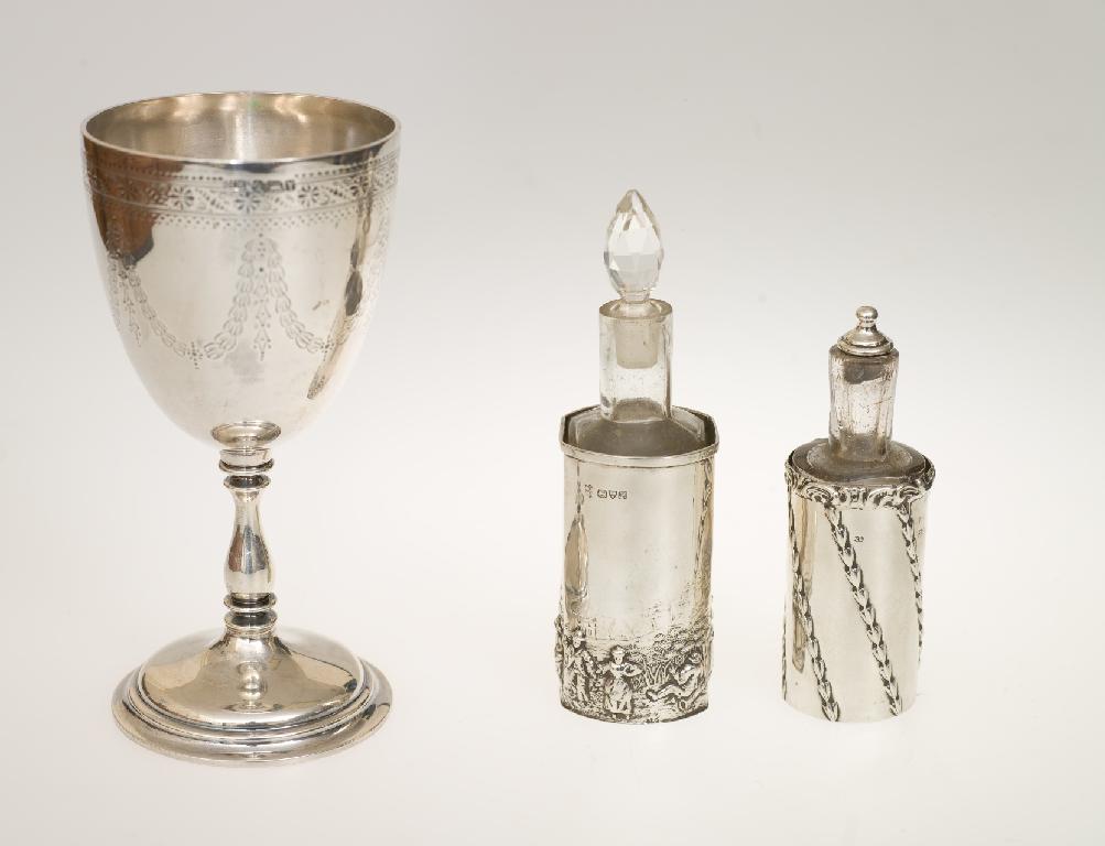 Appraisal: TWO EDWARDIAN SCENT BOTTLES EACH IN A SILVER SLEEVE the