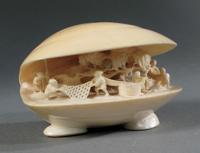 Appraisal: JAPANESE CARVED IVORY OYSTER interior with a detailed scene of