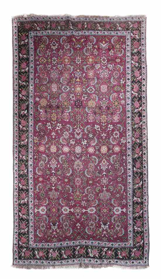 Appraisal: A Persian Wool Runner decorated with repeating medallions stylized birds