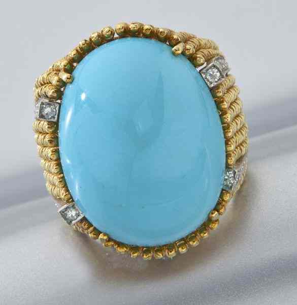 Appraisal: K gold Persian turquoise and diamond ringfeaturing an oval cabochon