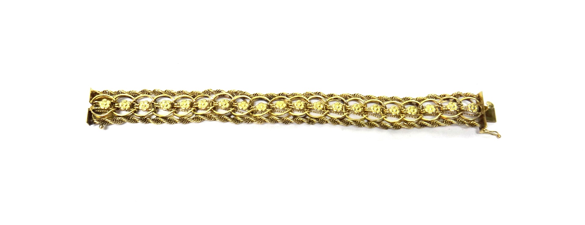 Appraisal: A gold bracelet the centre linkage formed as a row