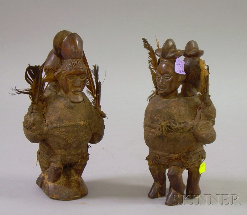 Appraisal: Two Congo-style Carved Fetish Figures ht to in