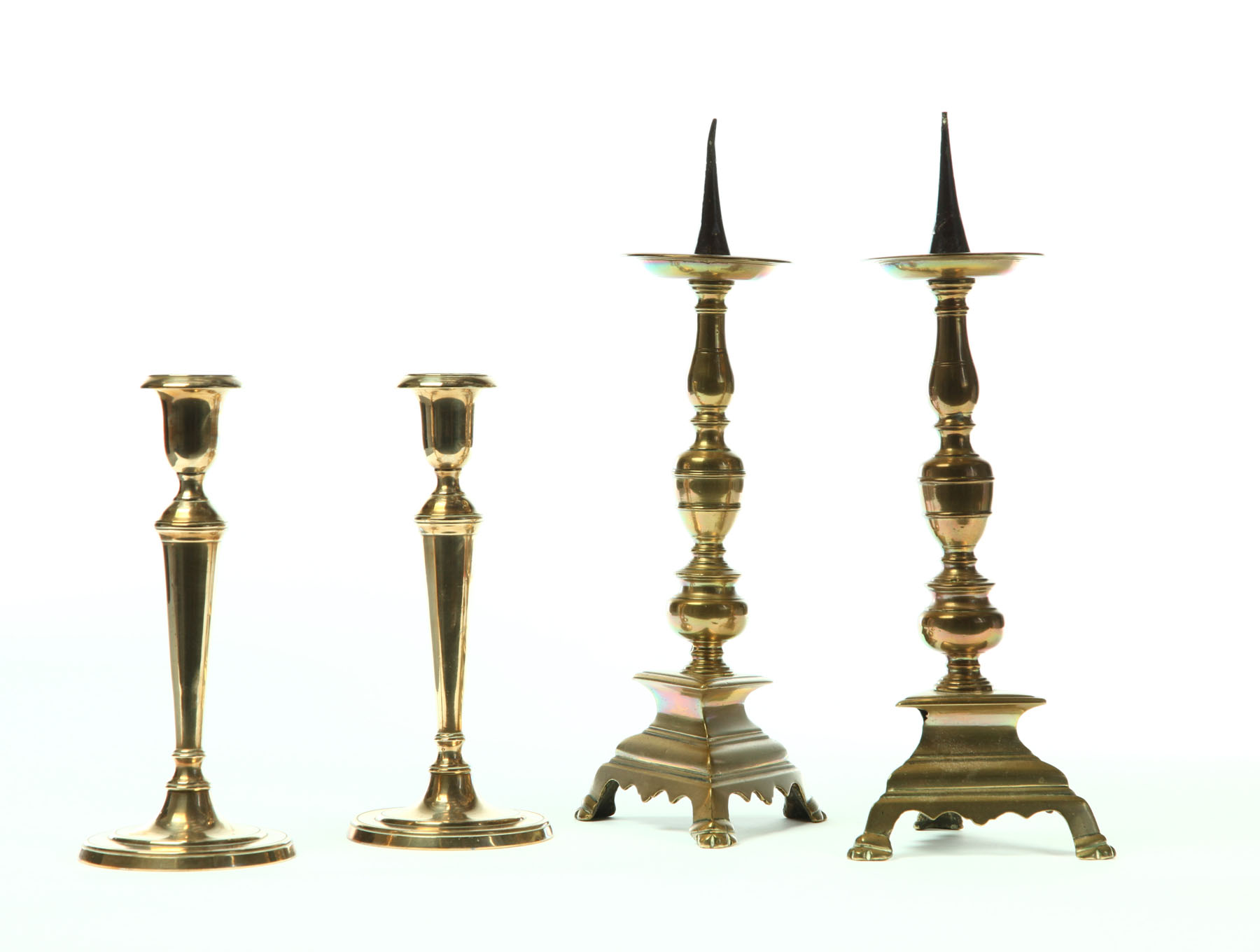 Appraisal: TWO PAIR OF BRASS CANDLESTICKS Spain early th century pricket