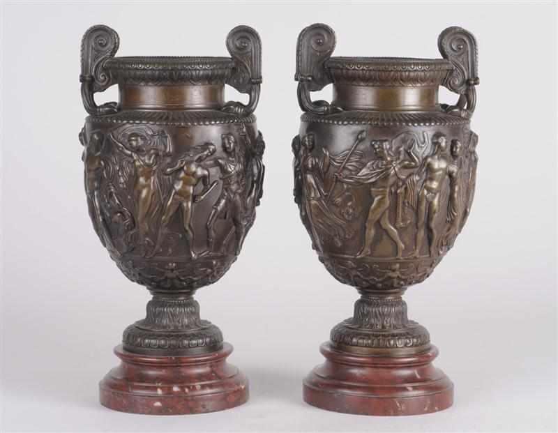 Appraisal: PAIR OF BRONZE TWO-HANDLED URNS AFTER THE ANTIQUE Each ovoid