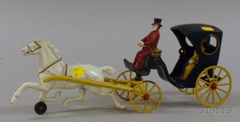 Appraisal: Painted Cast Iron Horse-drawn Carriage with Driver and Passenger