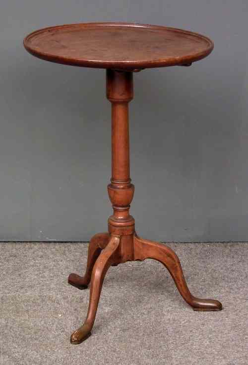 Appraisal: A late mahogany circular tray top tripod table on slender