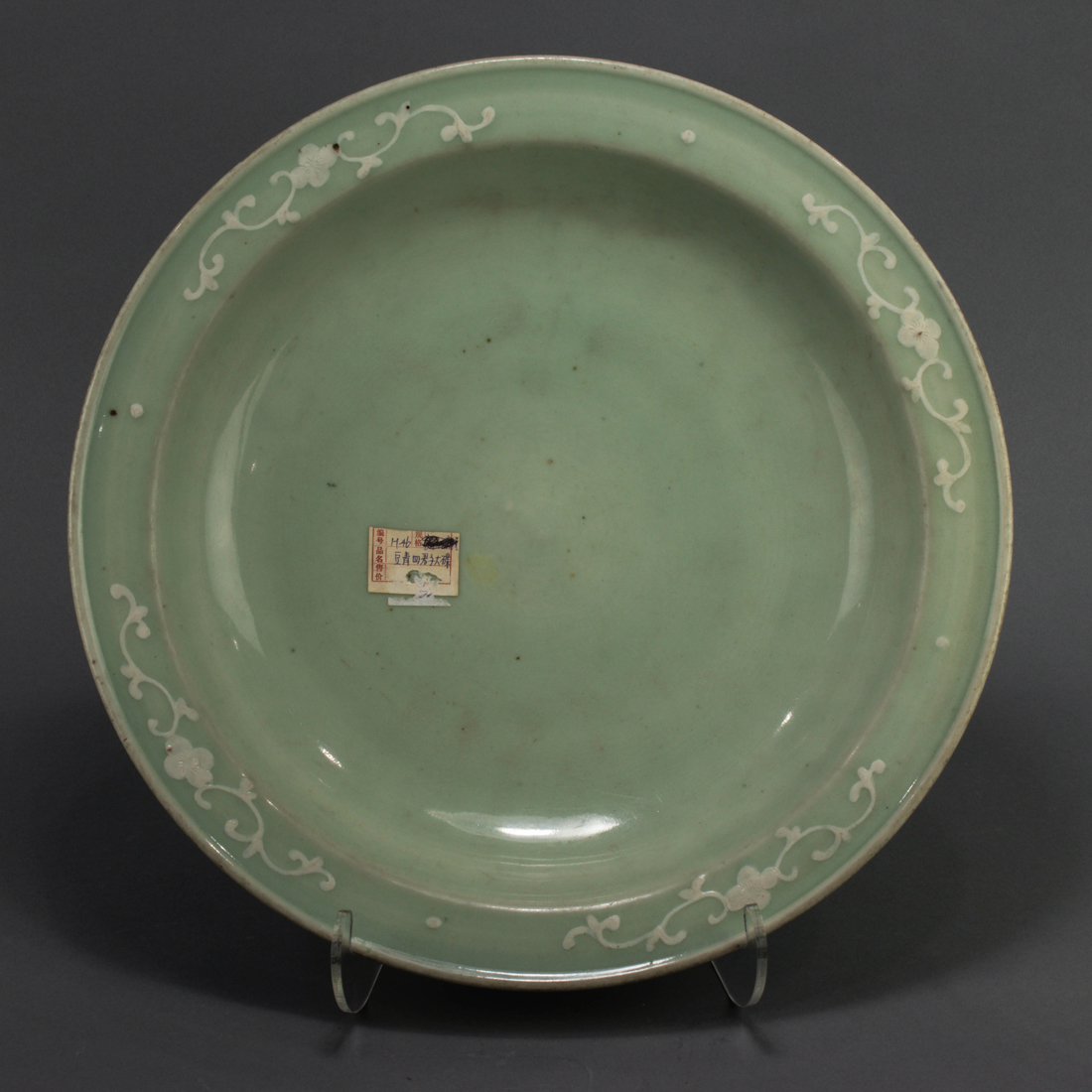 Appraisal: CHINESE CELADON GLAZED AND WHITE SLIP DECORATED CHARGER Chinese celadon