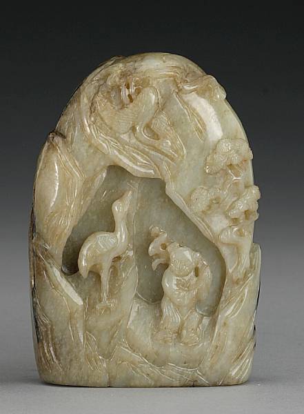 Appraisal: A carved nephrite boulder Of flattened oval format and carved