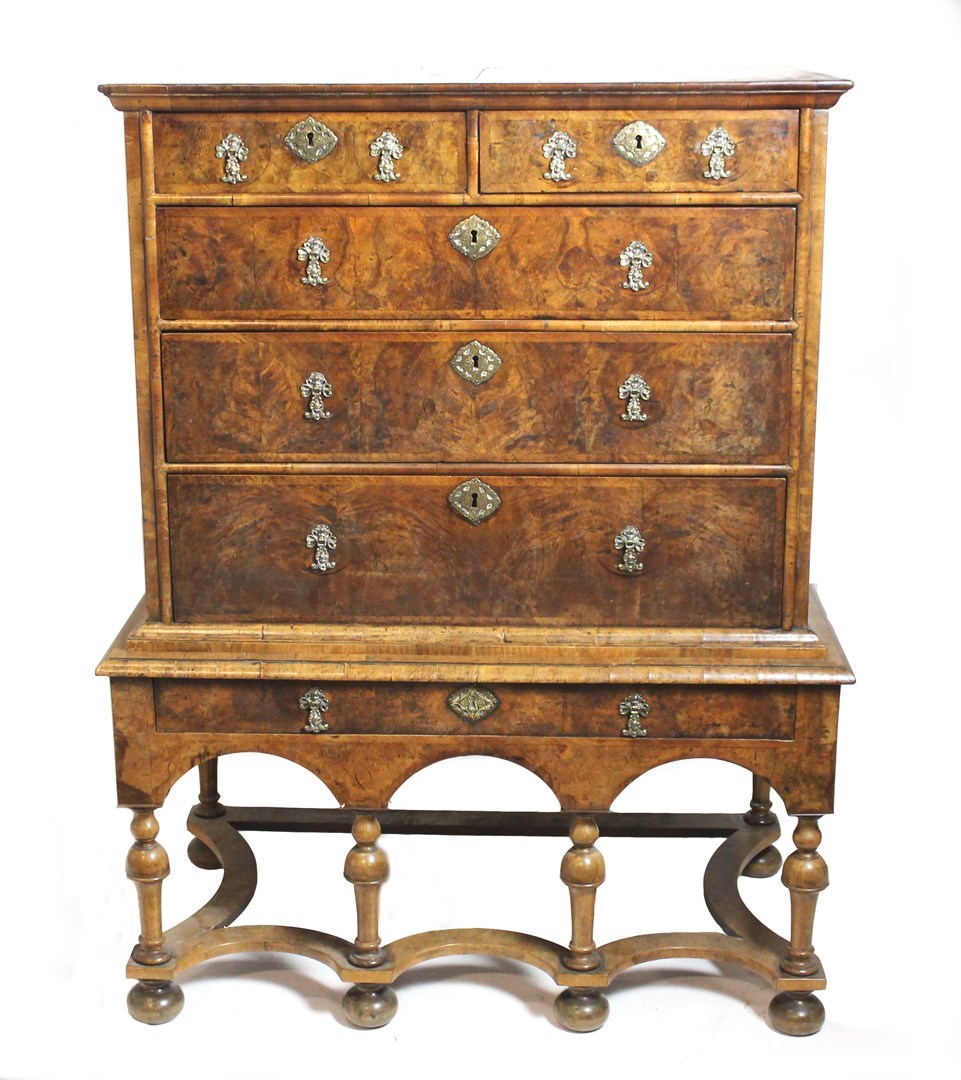 Appraisal: A George III and later figured walnut chest on stand