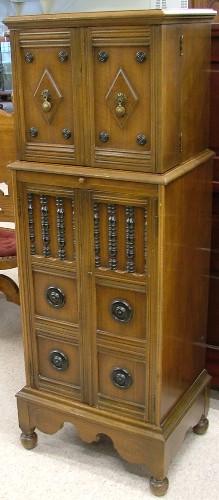 Appraisal: WALNUT HUMIDOR BAR CABINET-ON-CABINET American c 's The smaller top